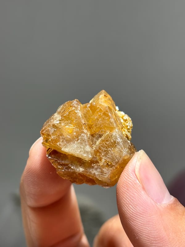 Honey scheelite floater group with mica from Xuebaoding, Sichuan, China, second angle