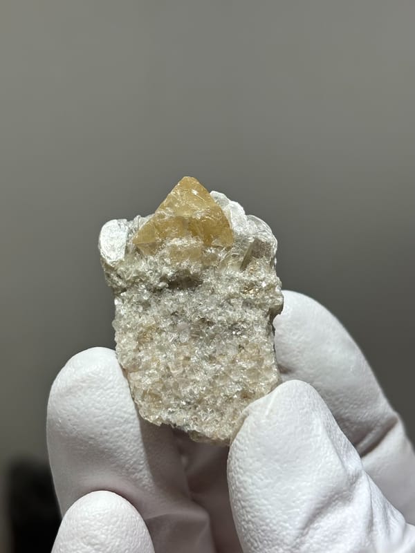 Honey scheelite crystal on mica block from Xuebaoding, Sichuan, China, second angle