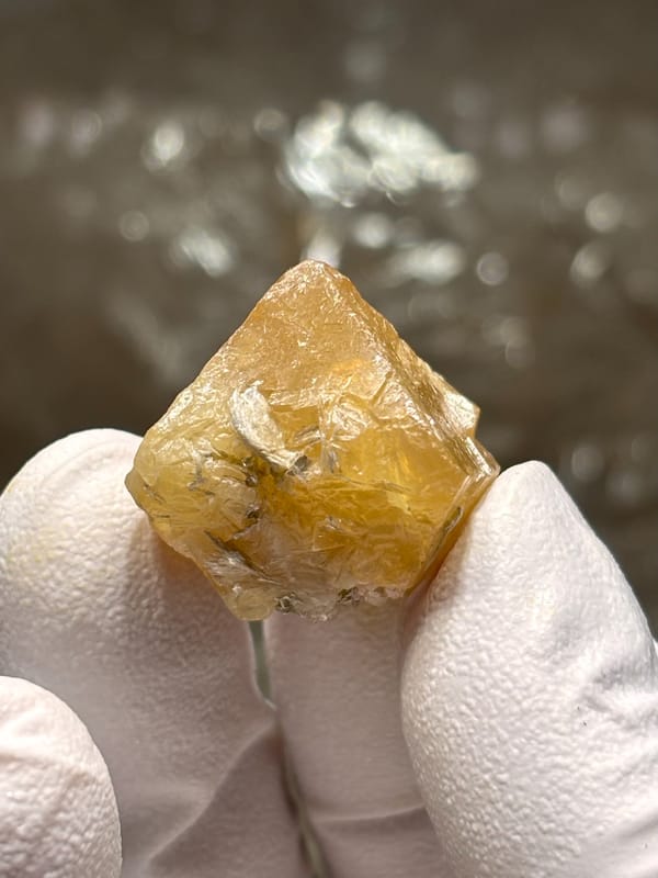 Small honey scheelite crystal from Xuebaoding, Sichuan, China, second angle