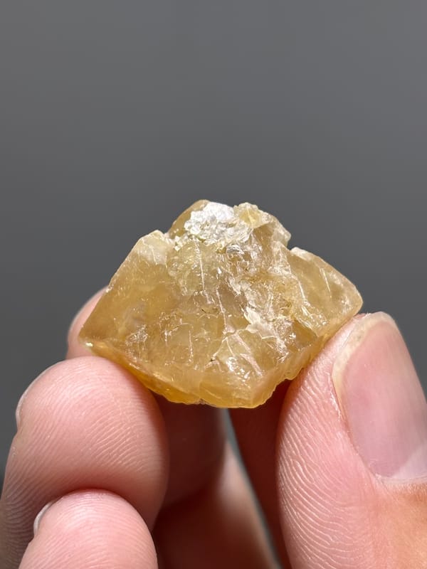 Honey scheelite with frosted top from Xuebaoding, Sichuan, China, reverse side