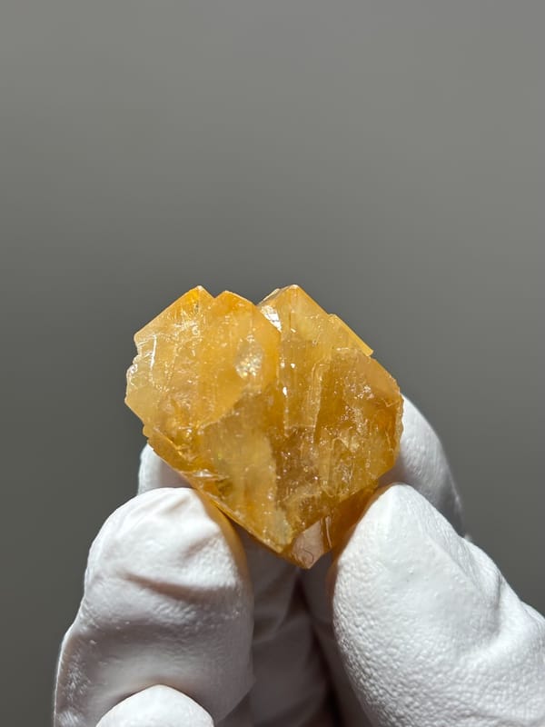 Honey scheelite crystal from Xuebaoding, Sichuan, China, close-up of the crystal faces