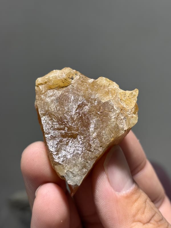 Honey-orange scheelite floater from Xuebaoding, Sichuan, China, reverse side