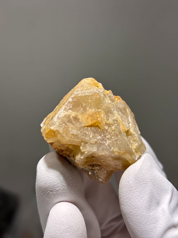 Honey-orange scheelite with mica on its faces from Xuebaoding, Sichuan, China, second angle