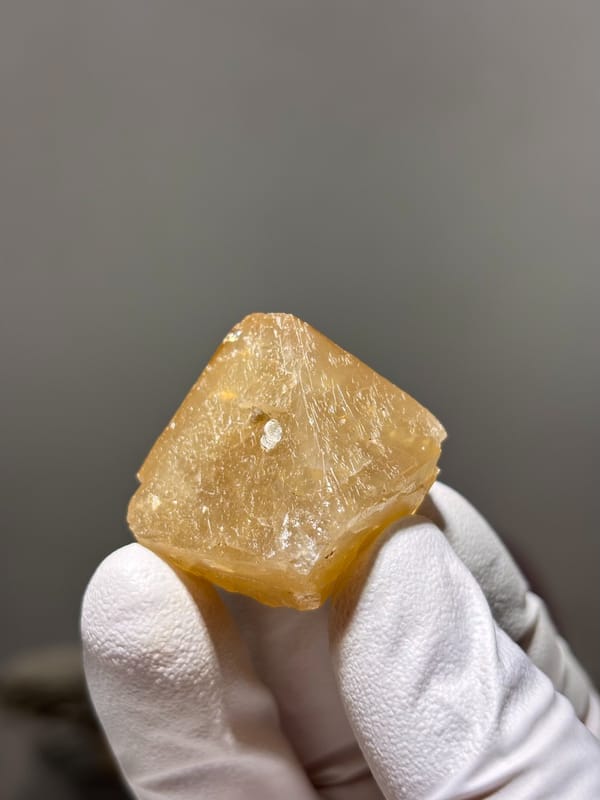 Honey-orange scheelite crystal from Xuebaoding, Sichuan, China, reverse side