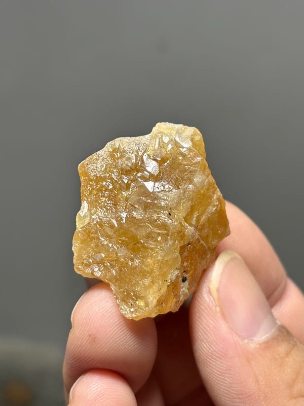 Honey-yellow scheelite crystal from Xuebaoding, Sichuan, China, reverse side