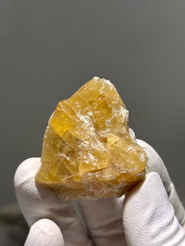 Honey-yellow scheelite crystal group from Xuebaoding, Sichuan, China, close-up of the crystal faces