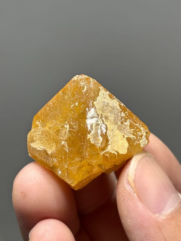 Orange scheelite crystal with white calcite from Xuebaoding, Sichuan, China, second angle