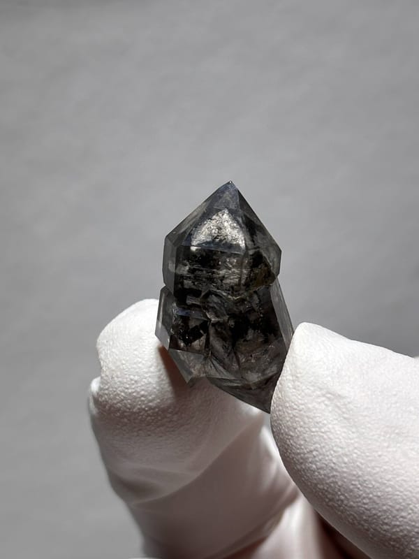 Stout black double-terminated quartz with clear cap from Yunnan, China, reverse side