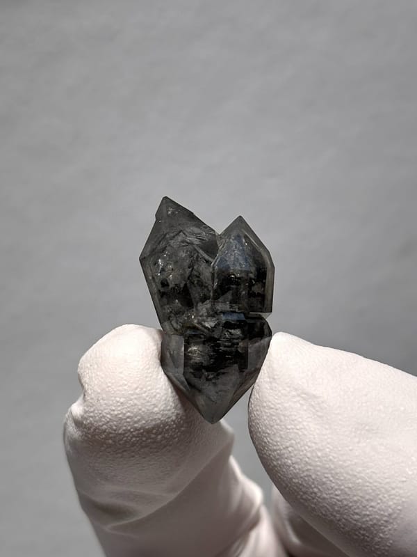 Stout black double-terminated quartz with clear cap from Yunnan, China, top view