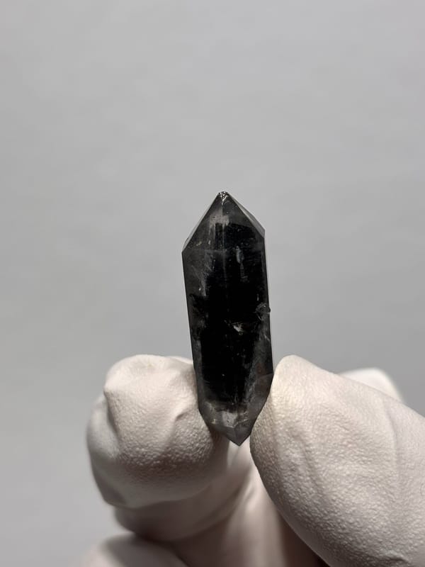 Black double-terminated quartz with clear tip from Yunnan, China, top view