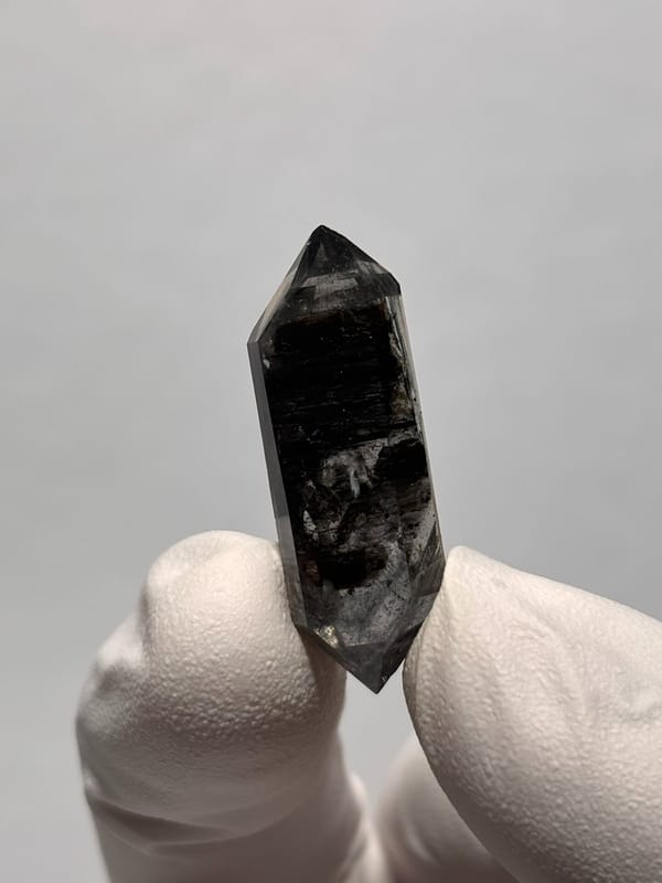 Black double-terminated quartz with clear tip from Yunnan, China, top view
