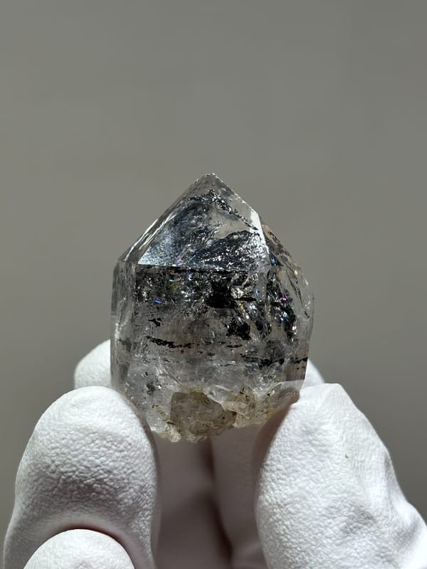Stout black quartz with floater base from Yunnan, China, close-up of the crystal faces