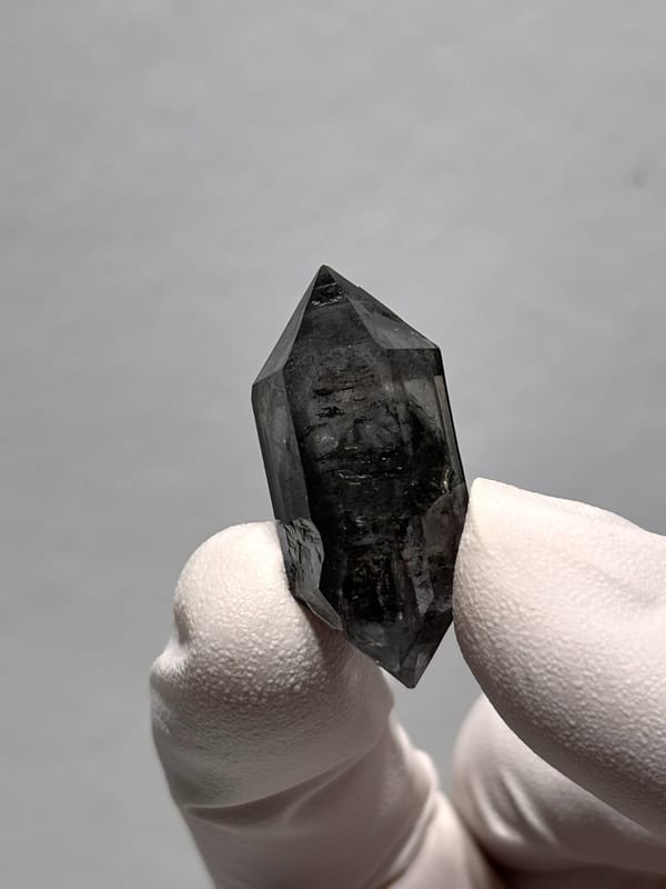 Stout black double-terminated quartz with sparkles from Yunnan, China, reverse side