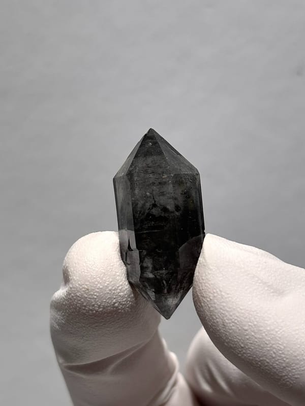 Stout black double-terminated quartz with sparkles from Yunnan, China, top view