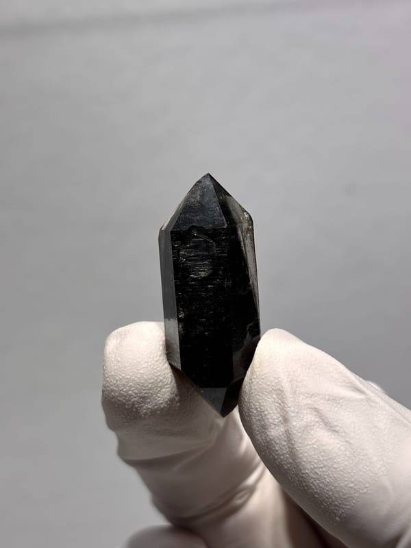 Stout black double-terminated quartz from Yunnan, China, close-up of the crystal faces