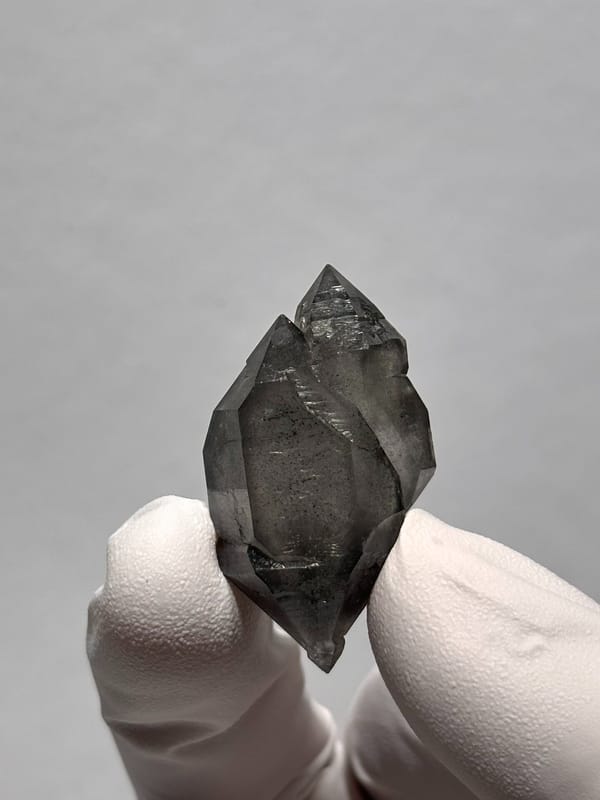 Black double-terminated quartz pair from Yunnan, China, close-up of the crystal faces