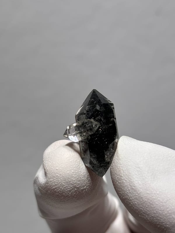 Tiny black double-terminated quartz with side crystal from Yunnan, China, reverse side