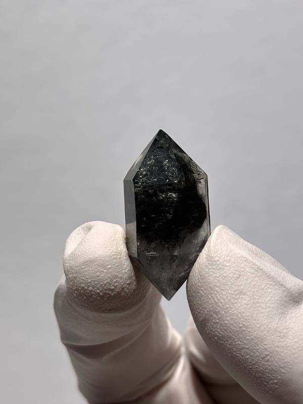 Stout black double-terminated quartz from Yunnan, China, close-up of the crystal faces