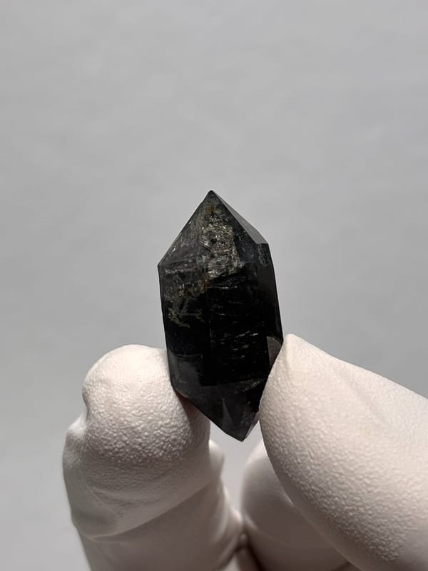 Stout black double-terminated quartz from Yunnan, China, close-up of the crystal faces