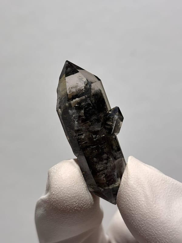 Black double-terminated quartz with golden flecks from Yunnan, China, reverse side