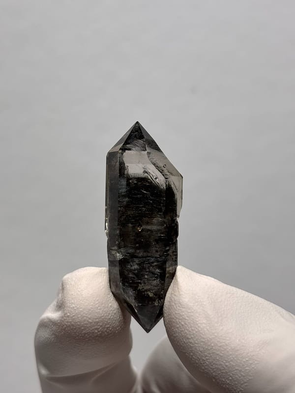 Black double-terminated quartz with golden flecks from Yunnan, China, top view