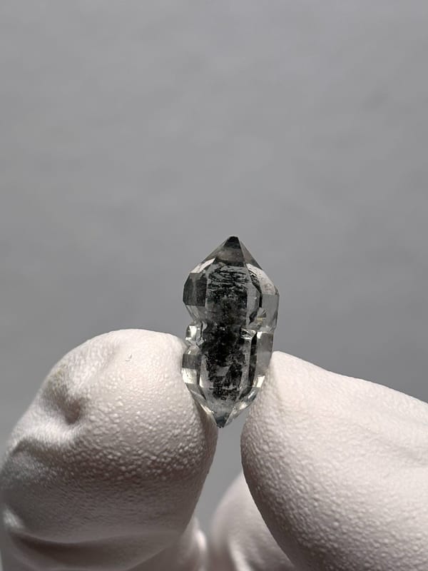 Very tiny black sugar-core double-terminated quartz from Yunnan, China, reverse side