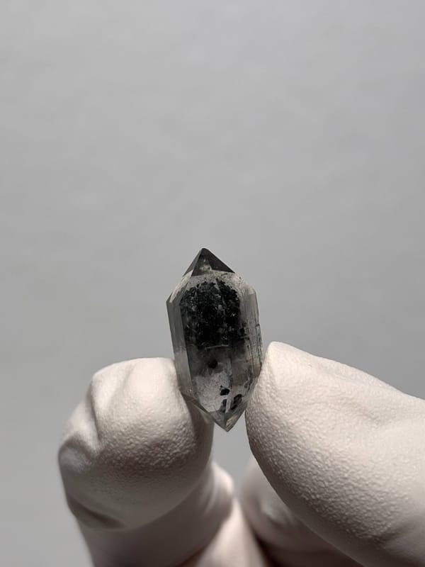 Tiny black sugar-core double-terminated quartz from Yunnan, China, reverse side