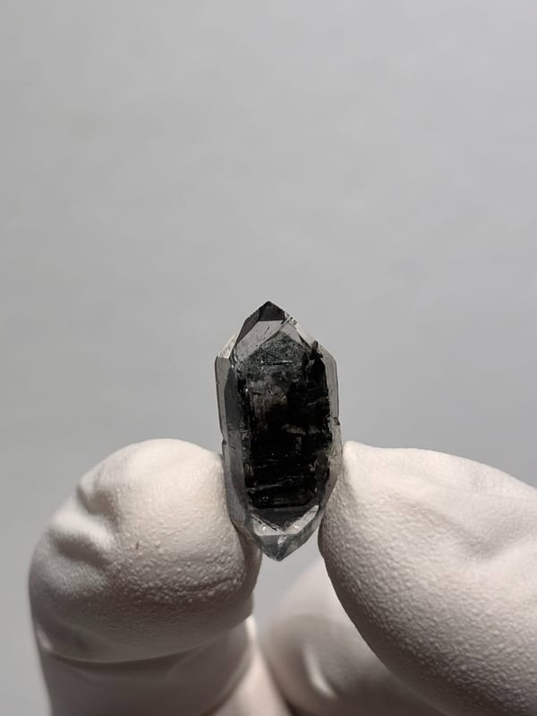 Tiny black sugar-core double-terminated quartz from Yunnan, China, reverse side