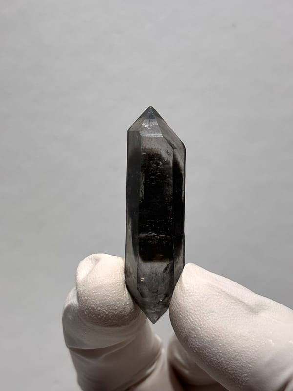 Slender black sugar-core double-terminated quartz from Yunnan, China, reverse side
