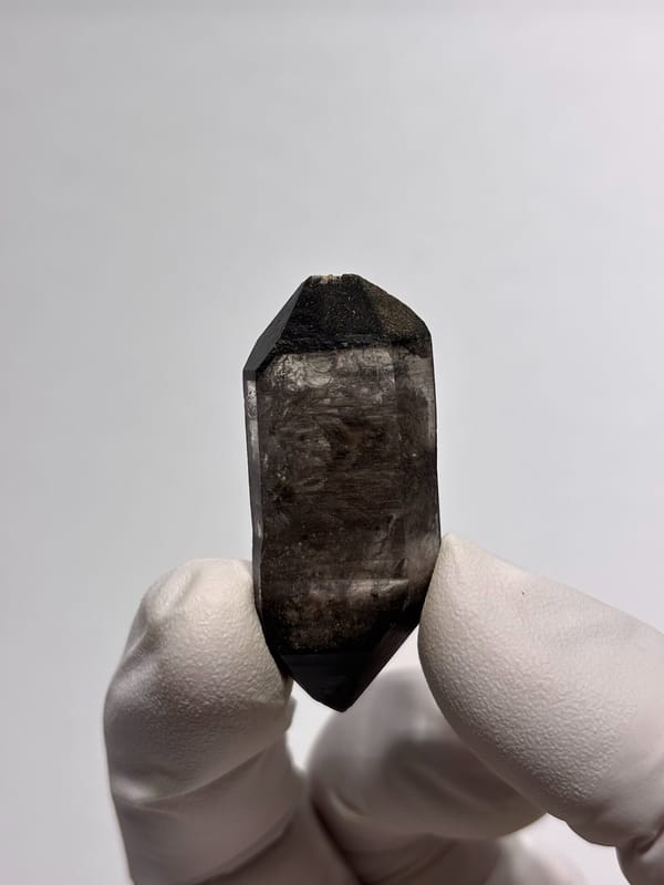 Black-capped double-terminated quartz from Guizhou, China, close-up of the crystal faces
