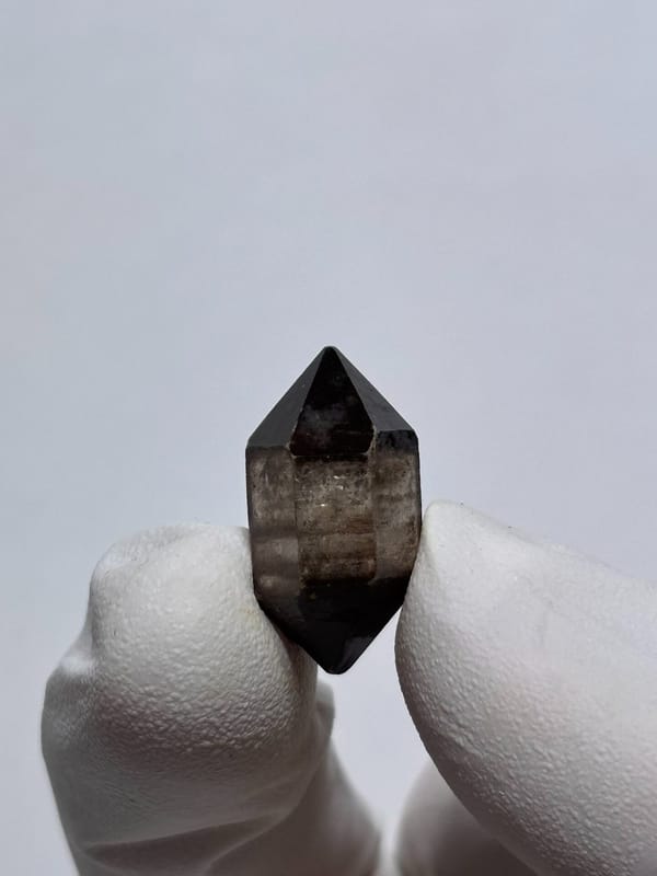 Tiny black-capped double-terminated quartz from Yunnan, China, second angle