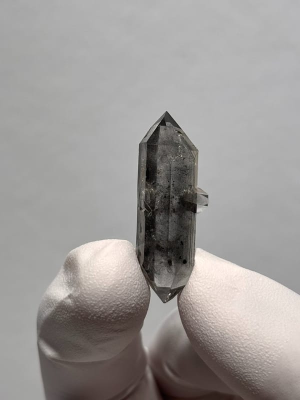Black-flecked double-terminated quartz with side crystal from Yunnan, China, reverse side