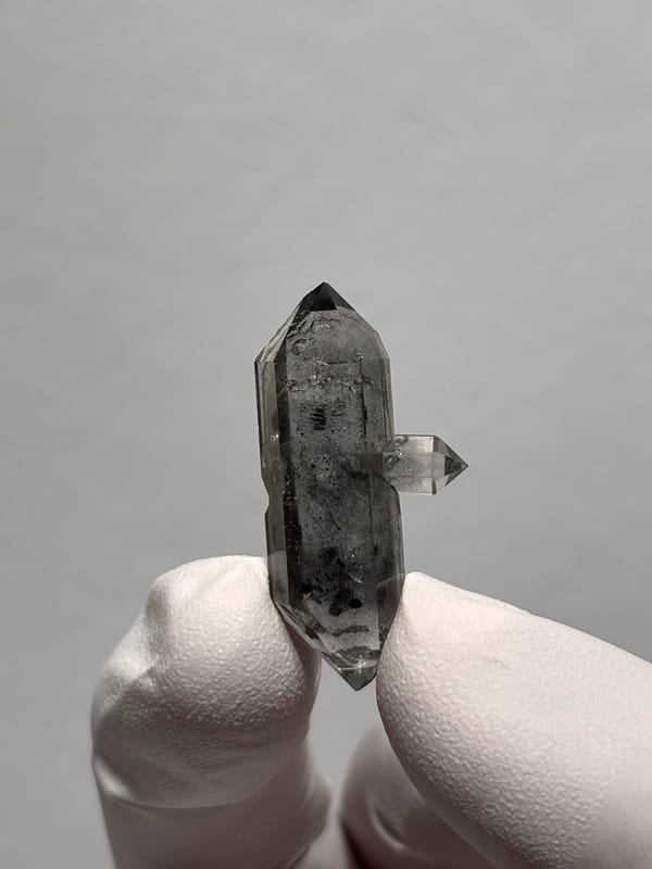 Black-flecked double-terminated quartz with side crystal from Yunnan, China, top view