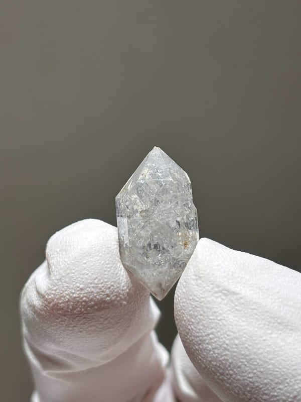 Tiny burst-crystal double-terminated quartz with sparkles from Yunnan, China, reverse side