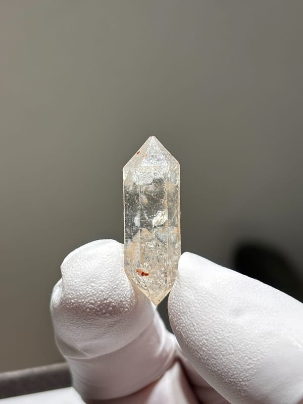 Tiny burst-crystal double-terminated quartz with golden flecks from Yunnan, China, second angle