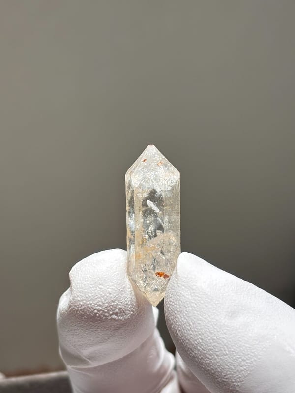 Tiny burst-crystal double-terminated quartz with golden flecks from Yunnan, China, reverse side
