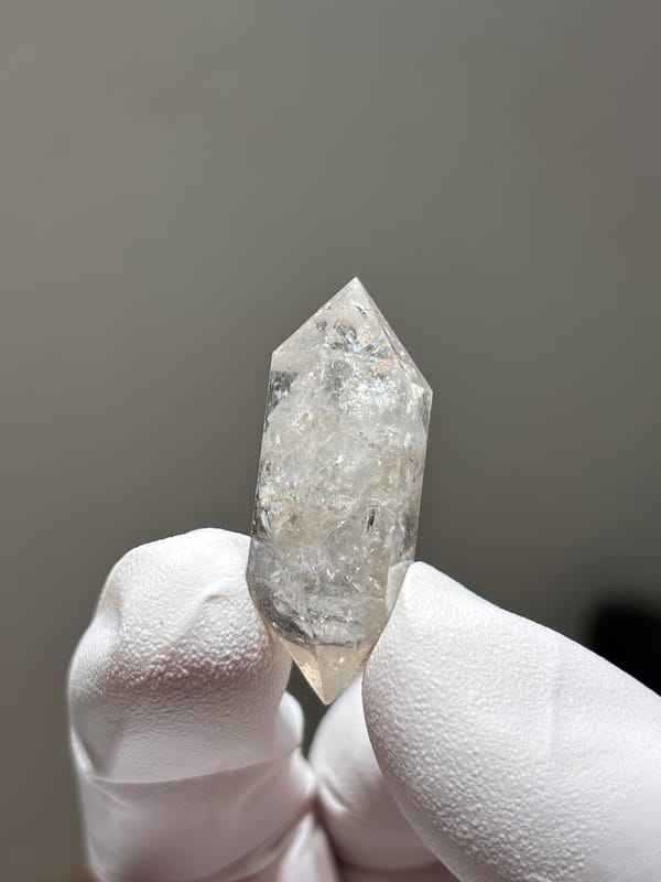 Burst-crystal double-terminated quartz with sparkling flecks from Yunnan, China, close-up of the crystal faces