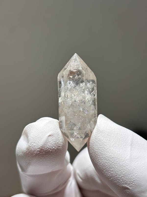 Burst-crystal double-terminated quartz with sparkling flecks from Yunnan, China, reverse side