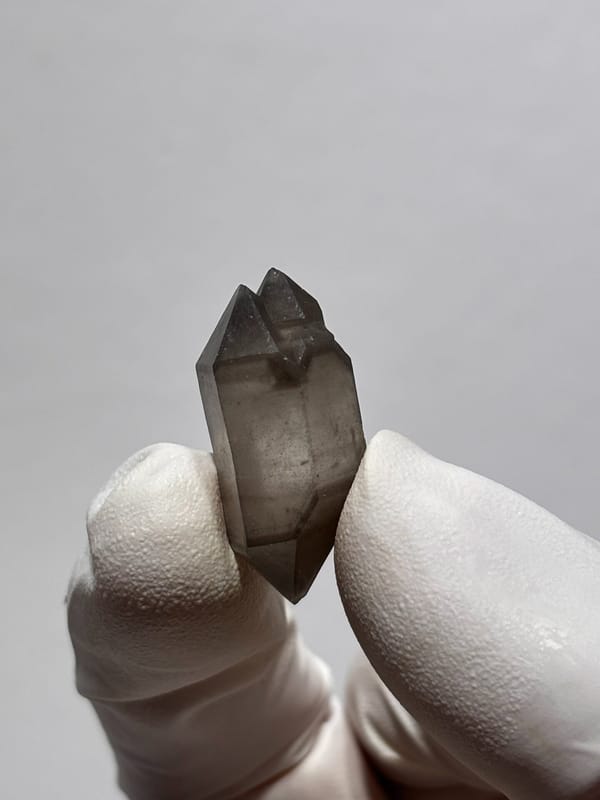 Tiny smoky capped double-terminated quartz from Yunnan, China, second angle