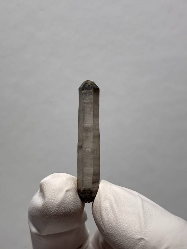 Needle-thin capped double-terminated quartz from Yunnan, China, close-up of the crystal faces