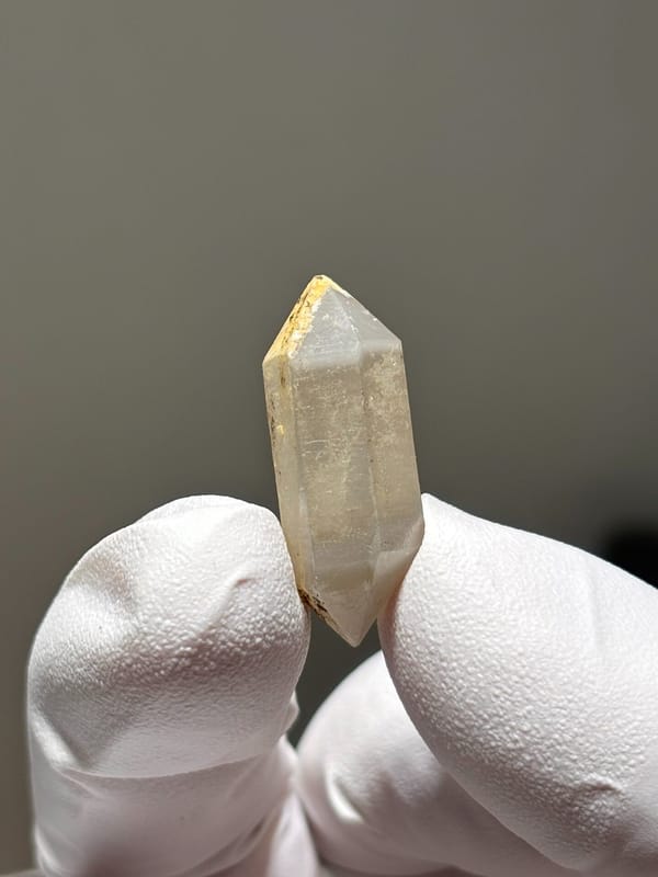 Tiny golden-capped double-terminated quartz from Yunnan, China, second angle