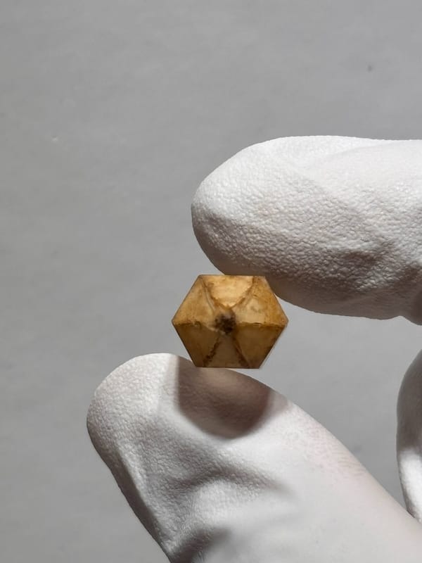 Orange-capped double-terminated quartz with flowered tips from Yunnan, China, close-up of the crystal faces
