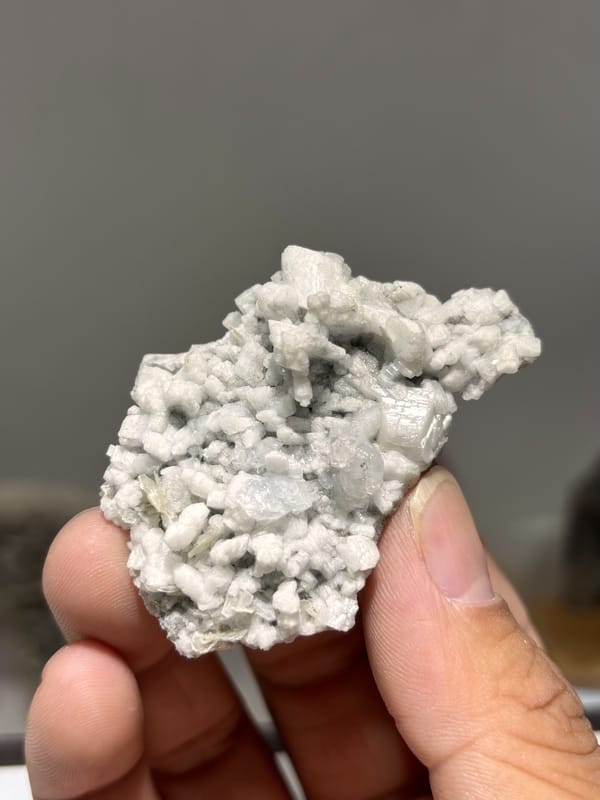 White feldspar plate with pale aquamarine and quartz from Xuebaoding, Sichuan, China, second angle