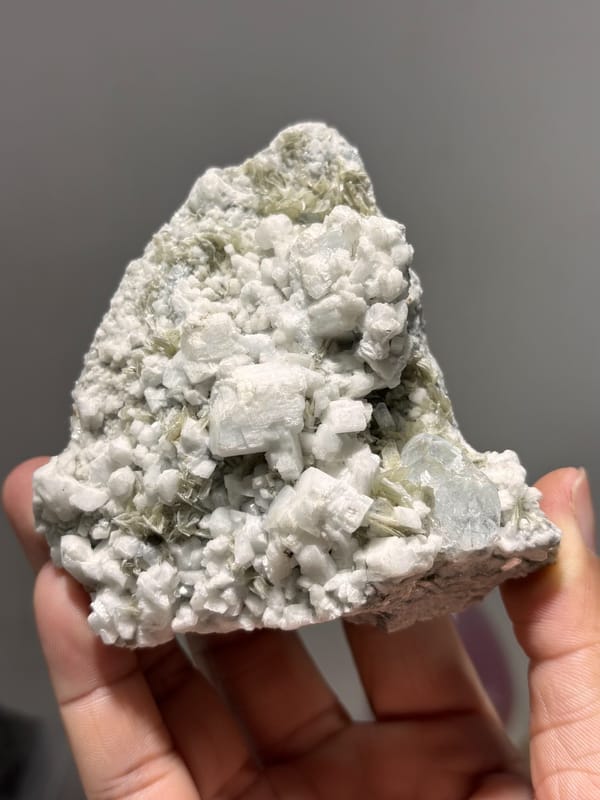 White feldspar plate with pale aquamarine crystals from Xuebaoding, Sichuan, China, second angle