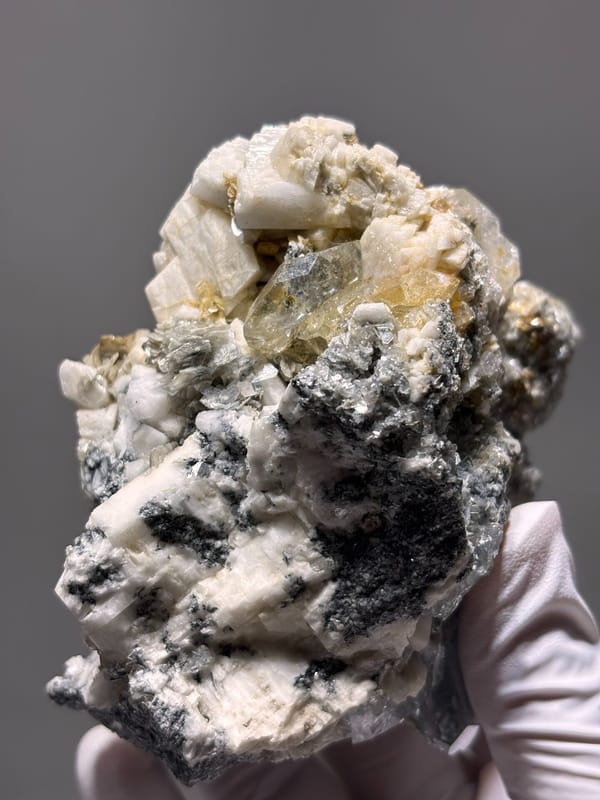 Aquamarine plate with mica and feldspar from Xuebaoding, Sichuan, China, close-up of the crystal faces
