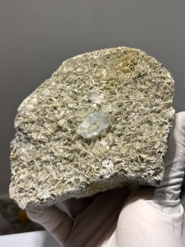 Silvery mica plate with pale aquamarine from Xuebaoding, Sichuan, China, reverse side