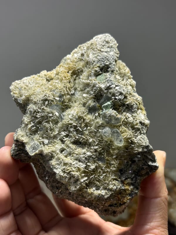 Mica plate with pale aquamarine from Xuebaoding, Sichuan, China, close-up of the crystal faces