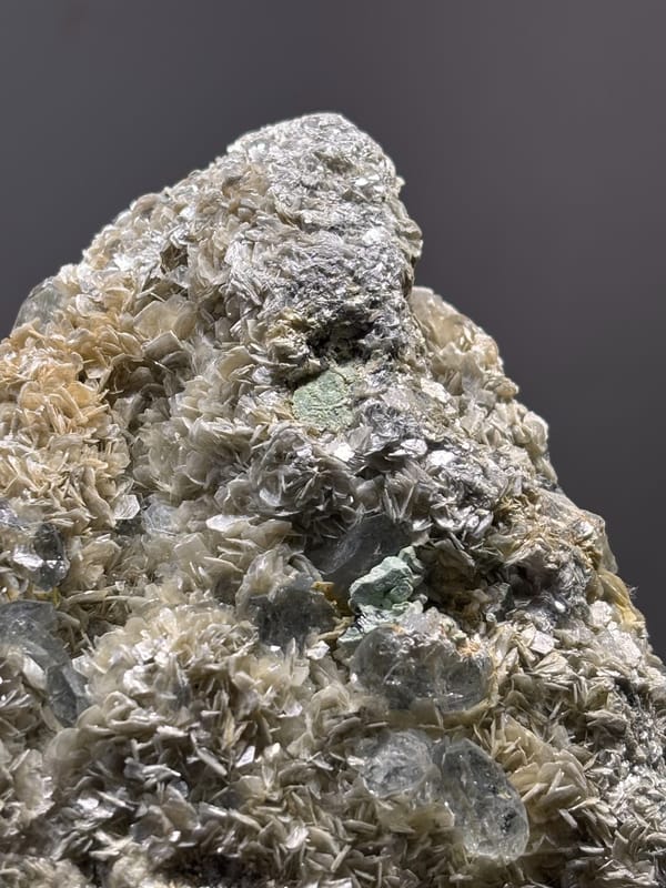 Mica plate with pale aquamarine from Xuebaoding, Sichuan, China, reverse side