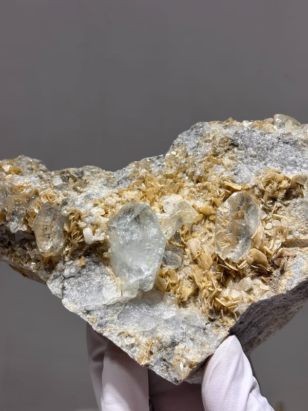Mica plate with pale aquamarine crystal from Xuebaoding, Sichuan, China, close-up of the crystal faces