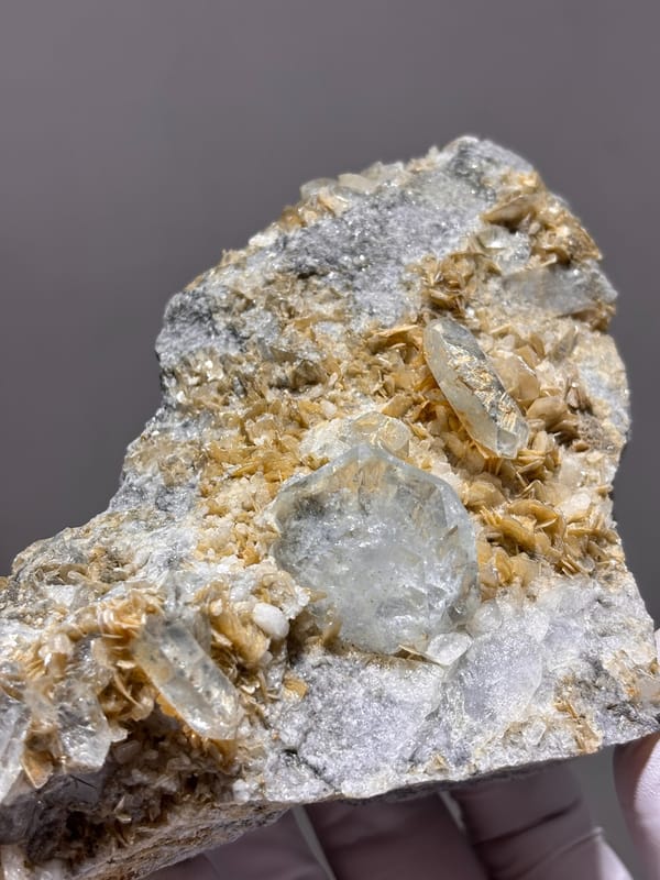 Mica plate with pale aquamarine crystal from Xuebaoding, Sichuan, China, reverse side